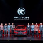 Group of PROTON, DRB-HICOM and MITI leaders standing on stage with the All-New Proton Saga during its official launch event.