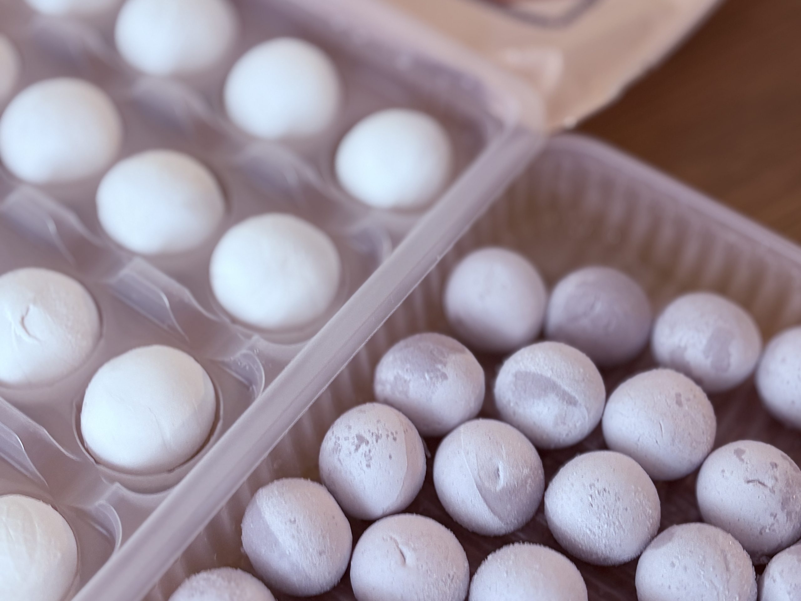 Store-bought frozen tang yuan with peanut, sesame, and other traditional fillings.